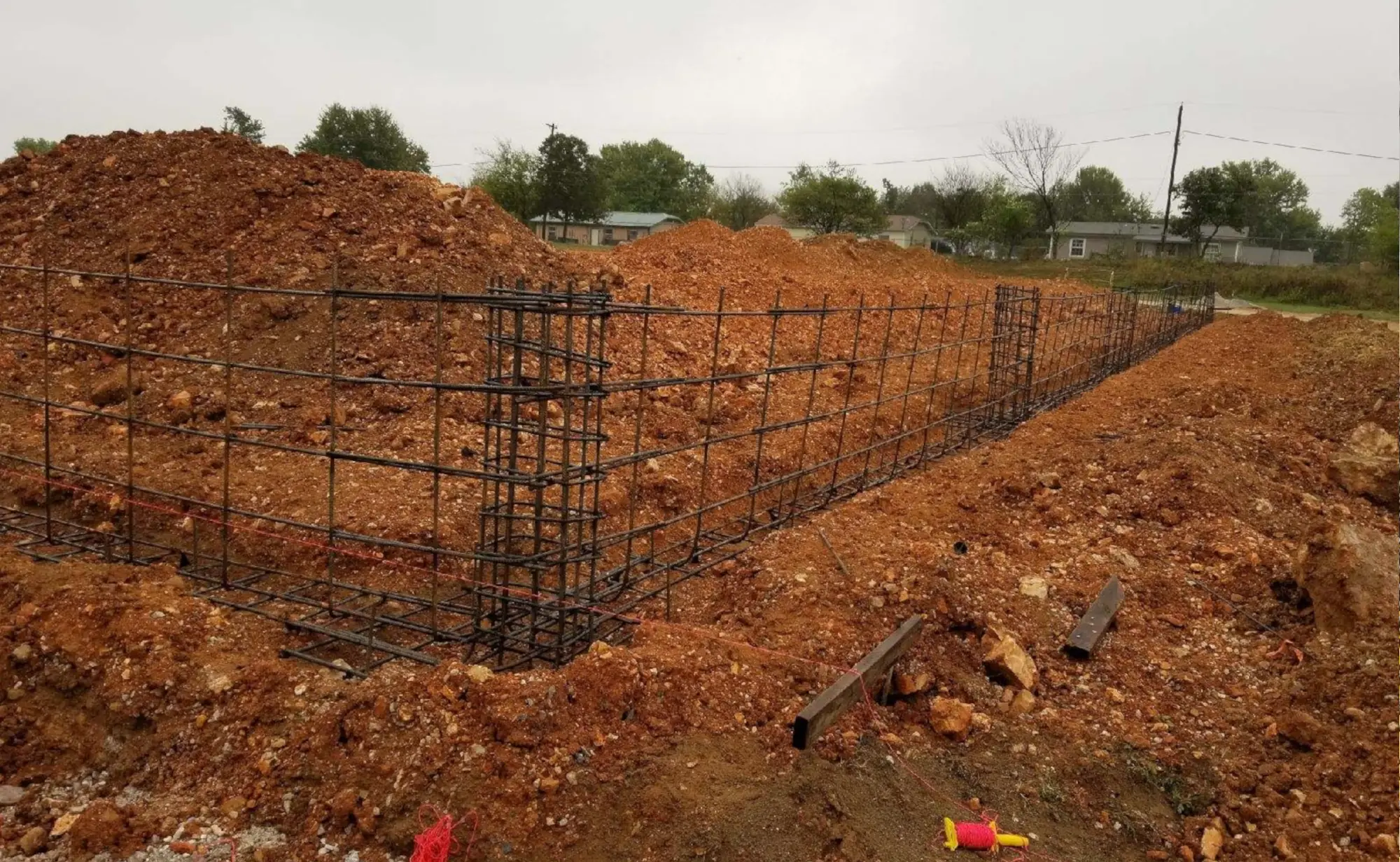 Concrete foundation work representative of shop building projects